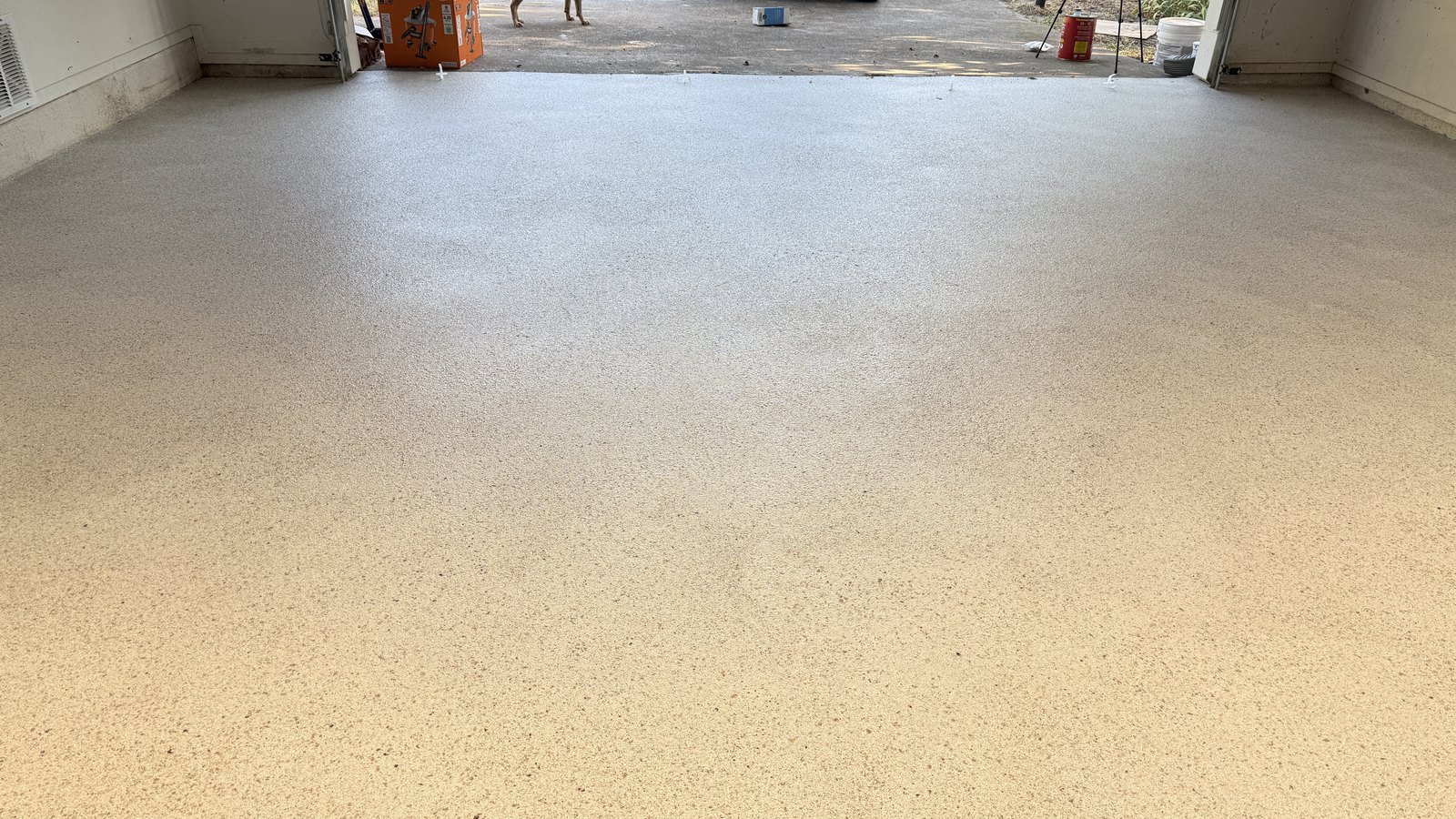 A finished flake epoxy garage floor in North Texas, the foundation of a garage gym or office conversion