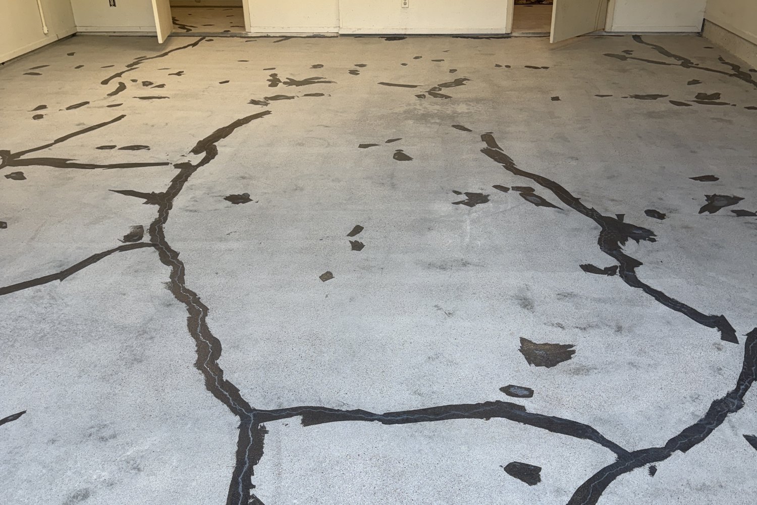 Crack filler applied to the garage slab before coating