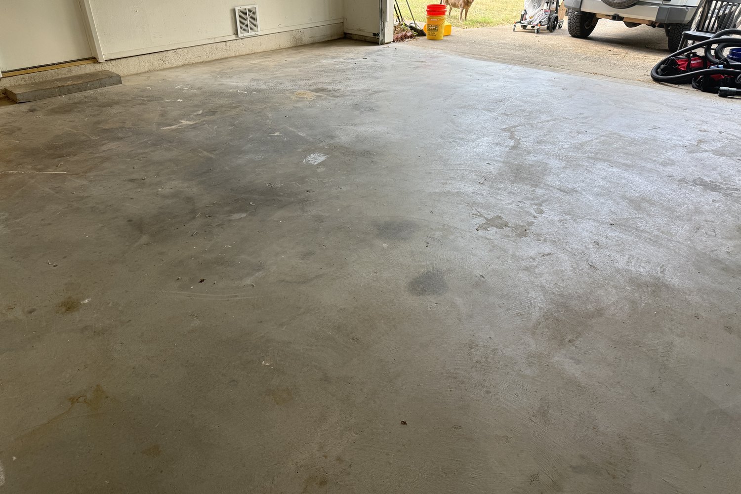 Before: garage floor looking out the open door