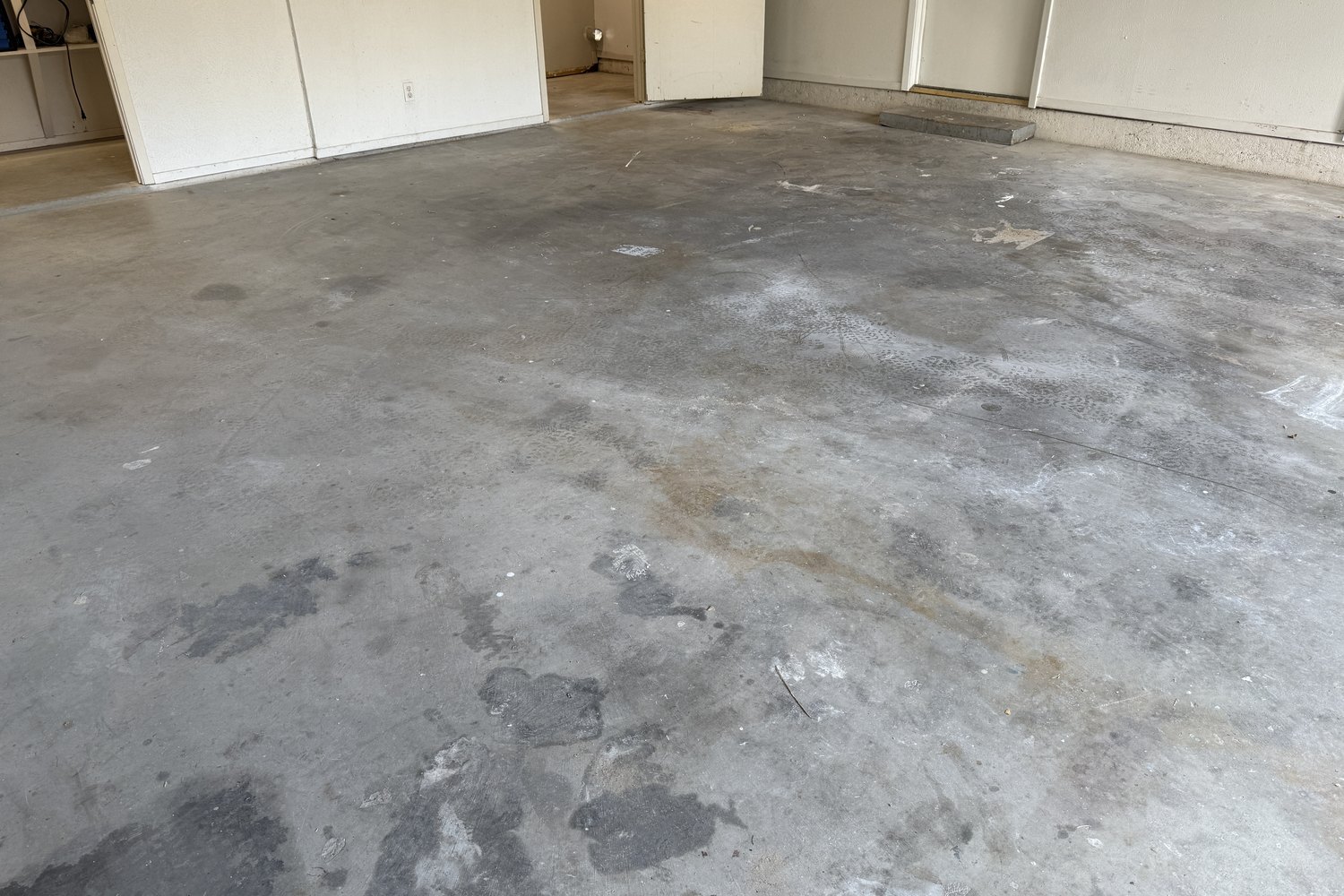 Before: garage floor at the back doors
