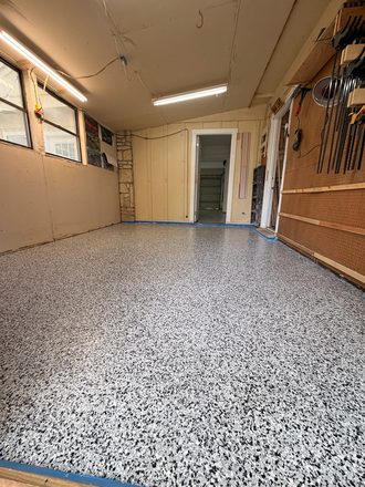 Finished flake garage floor by Happy Slab Coatings