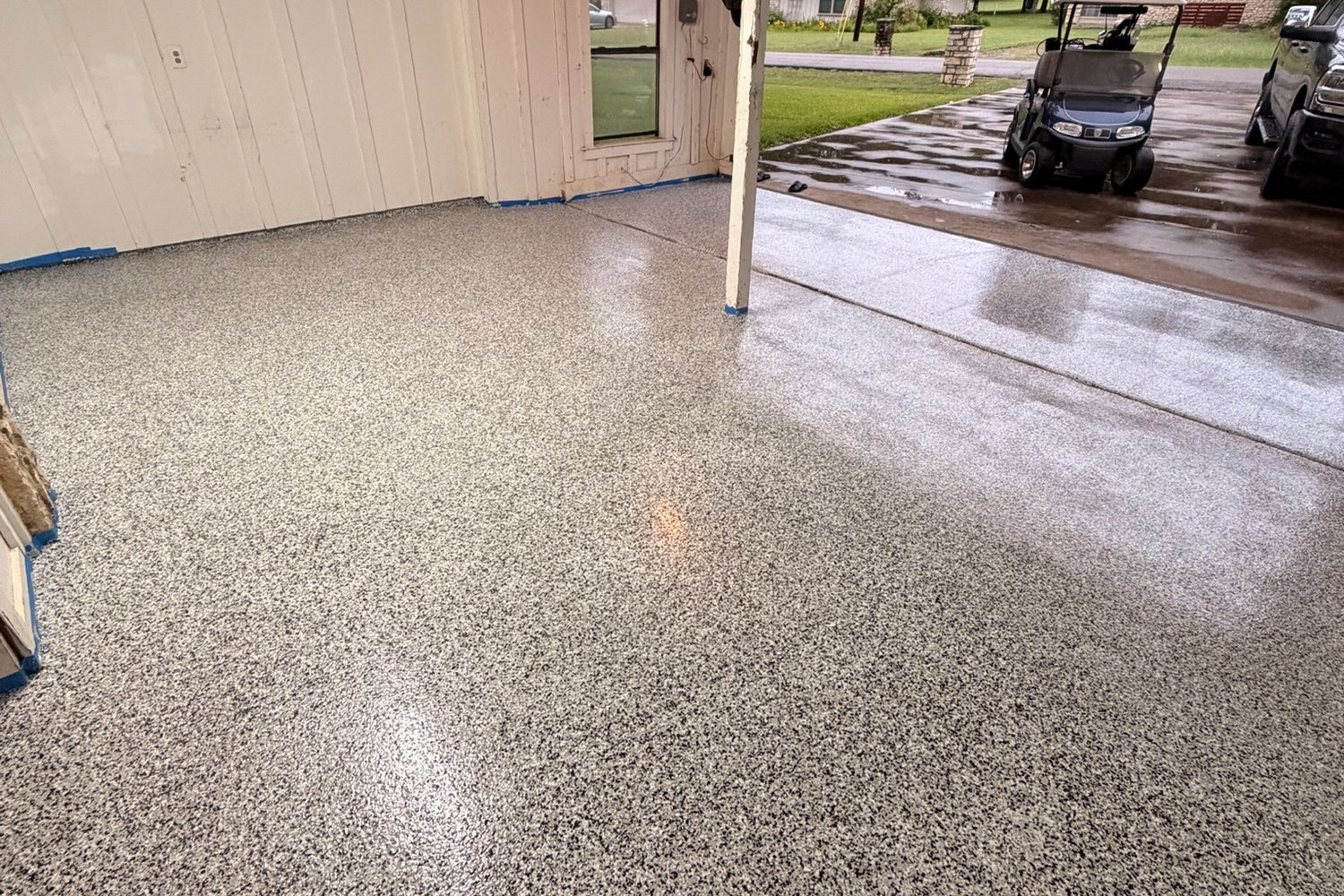 After: garage looking out the door, stained concrete to Domino flake
